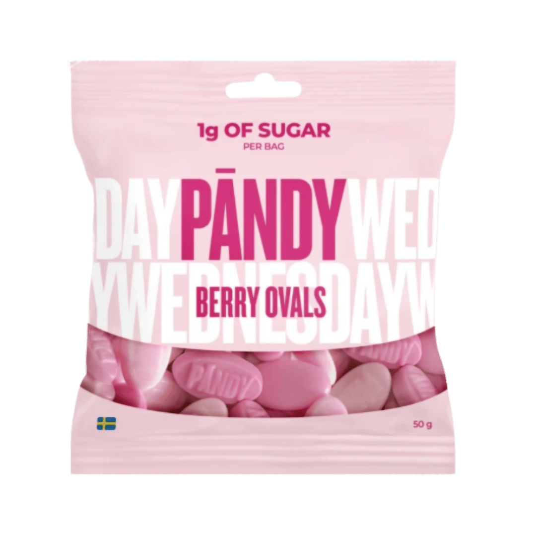 A 50g bag of Pandy Wednesday Berry Ovals candy. The packaging is light pink with bold magenta and white lettering, and a clear window at the bottom reveals the pink oval-shaped candy pieces inside.