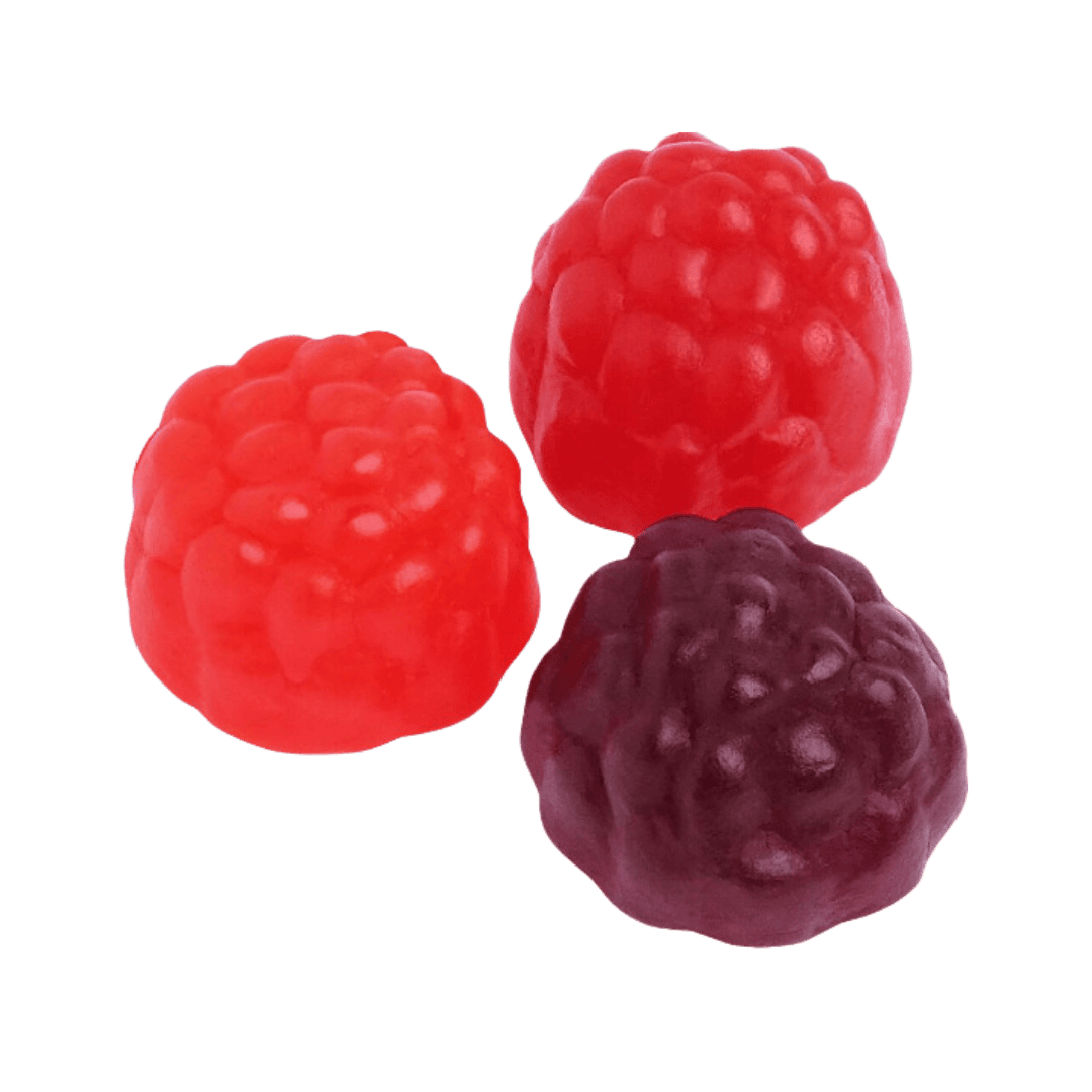 Three pieces of candy, two red and one blue, shaped like wild berries, set against a transparent background.