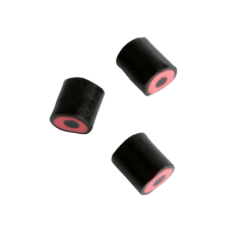 Three black candies with red licorice cores, displayed against a green background.