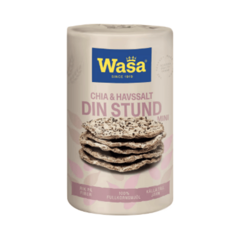 A cylindrical container of Wasa Chia and Flaxseed Salt Mini, featuring a cream-colored label with a blue brand logo and an image of two salted flatbreads, set against a solid green background.