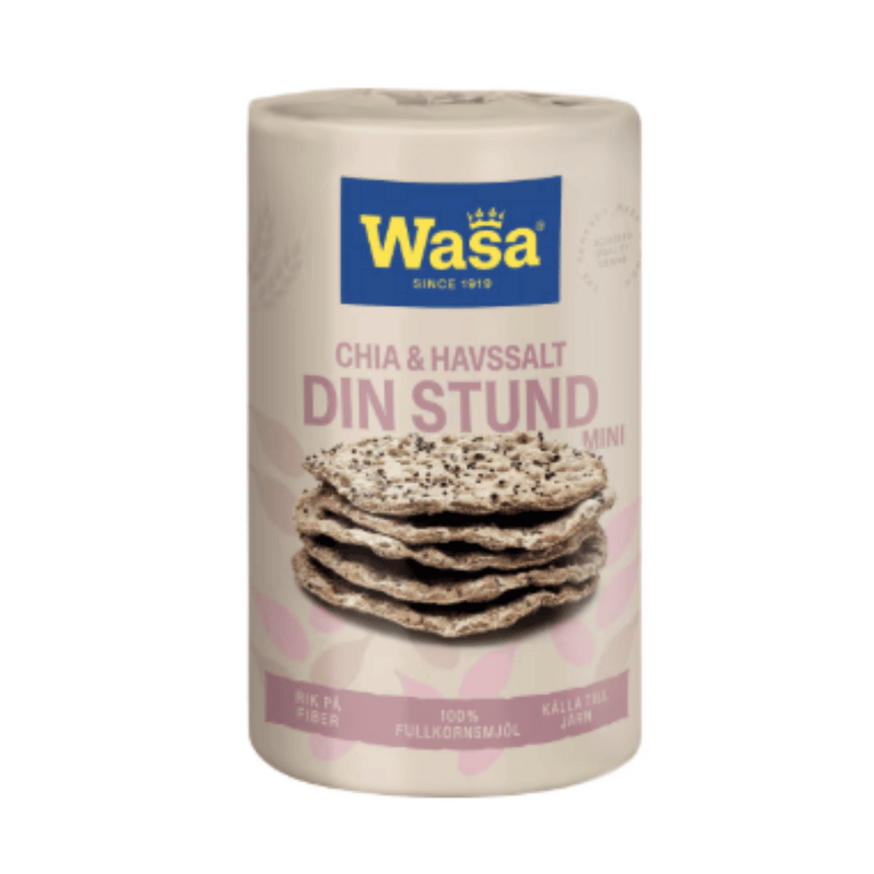 A cylindrical container of Wasa Chia and Flaxseed Salt Mini, featuring a cream-colored label with a blue brand logo and an image of two salted flatbreads, set against a solid green background.