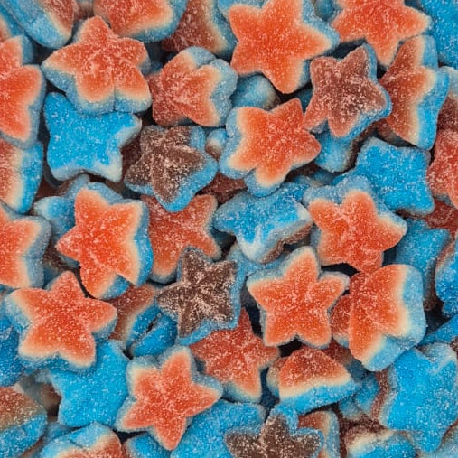 A clear plastic container filled with star-shaped gummy candies in blue, orange, and brown, photographed from above on a white surface.