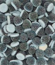 A close-up pile of sugar-dusted chocolate-dipped marshmallows, showing their dark brown coated tops and white inner centers.
