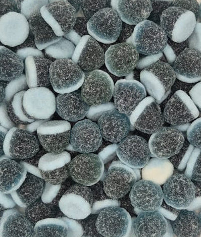 A close-up pile of sugar-dusted chocolate-dipped marshmallows, showing their dark brown coated tops and white inner centers.