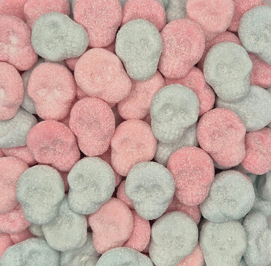 A close-up pile of round, sugar-dusted candies in pastel pink and pale mint green.