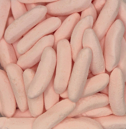 A close-up pile of pale pink, elongated marshmallow candies with a soft, textured surface.