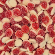 A close-up pile of red and white candy drops coated with sugar, filling the entire frame.